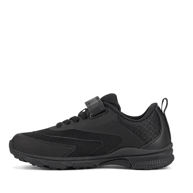The Harrison Nifty Black School Trainer is a kids’ sports shoe with a textured sole, breathable mesh panels, lace-up front, small hook-and-loop strap, and heel pull tab, shown in side profile against a white background., 48569, 48570, 48571, 9361913034997, 48573, 9361913035031, 48575, 48576, 48577, 48578, 48579, 48569, 48570, 48571, 9361913034997, 48573, 9361913035031, 9361913035055, 9361913035079, 48577, 9361913035116, 48579