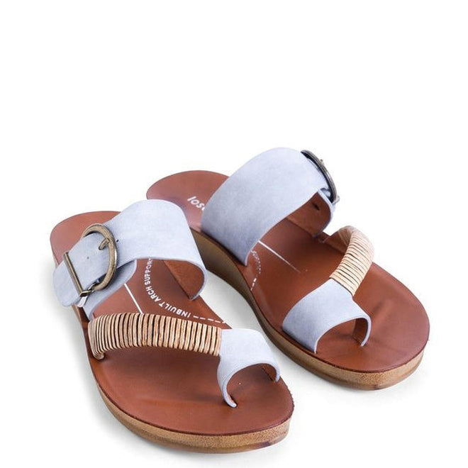 The Los Cabos Bria Cloud Gray Light Flexible Sandal Jandal features open-toe styling, wide light gray straps with tan woven accents, brown soles, and large metallic buckles—ideal summer sandals for any outfit., 46921, 9321191295886, 9321191295893, 9321191295909, 9321191295916, 46926, 9321191295930