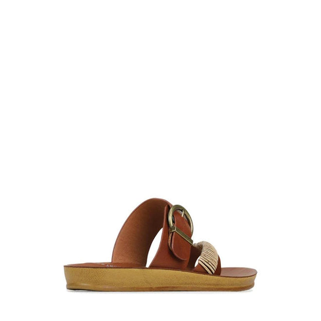 The Los Cabos Bria Cognac Light Flexible Sandal Jandal is a women’s thong sandal with a flat tan sole, two straps—one plain and one with a gold buckle and fringe—shown in profile against a white background., 46914, 9321191210063, 9321191210070, 9321191210087, 9321191210094, 9321191210100, 9321191210117