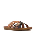 The Los Cabos Brik Black Brandy Zebra Women’s Slide Sandal features a tan sole with black and brandy criss-cross straps, braided detailing, and a gold buckle accent. Designed with an anatomical footbed for all-day comfort, these sustainable sandals seamlessly blend style and support.