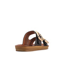 The Los Cabos Women’s Dina Black Light Flexible Two Strap Slide Sandal features black straps with large gold decorative buckles, a tan sole, and an anatomical footbed for enhanced comfort, shown from the back and side against a white background.
