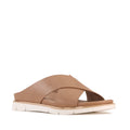The Los Cabos Terigal Women’s Slide Cross Over Sandal in Taupe showcases wide crisscross leather straps and a thick white sole, designed with a cushioning footbed for all-day comfort, displayed against a plain white background.