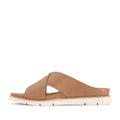 The Los Cabos Terigal Women’s Slide Cross Over Sandal in Taupe features wide, crisscross leather straps and a cream-colored flat sole with a cushioning footbed, displayed in a side profile against a white background., 9321190077964, 9321190077971, 9321190077988, 9321190077995, 9321190078008, 9321190078015