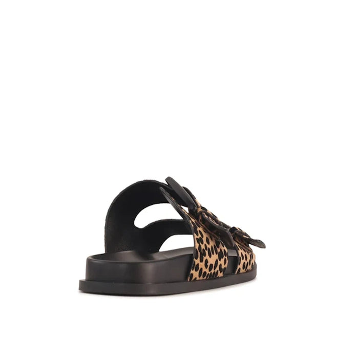 A side-rear view of the Los Cabos Zani Women’s Slide Double Strap Sandal in Black Leopard, showcasing its ergonomic black sole and two leopard print straps with black buckles. The sandal is angled to display both the side and back, highlighting its comfortable design and bold Leopard Print slide style., 9321190078664, 9321190078671, 9321190078688, 9321190078695, 9321190078701, 9321190078718, 53733