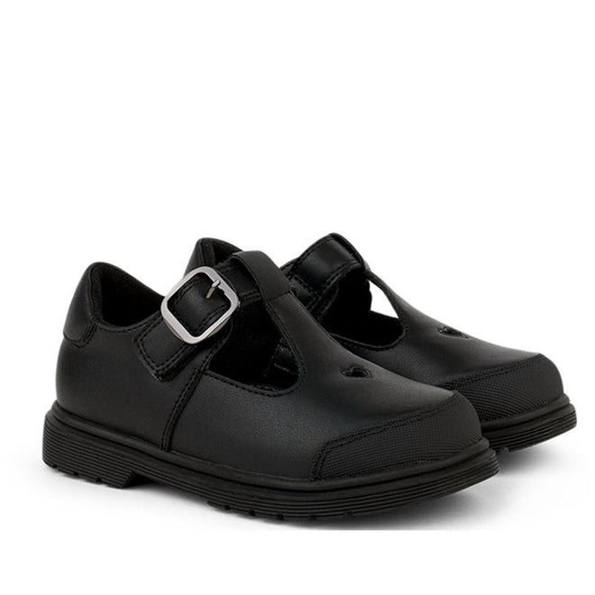 A pair of Pretty Brave Athena Trainer Black Leather T-Bar School Shoes with silver buckle and thick rubber soles, made from genuine leather, displayed on a white background.