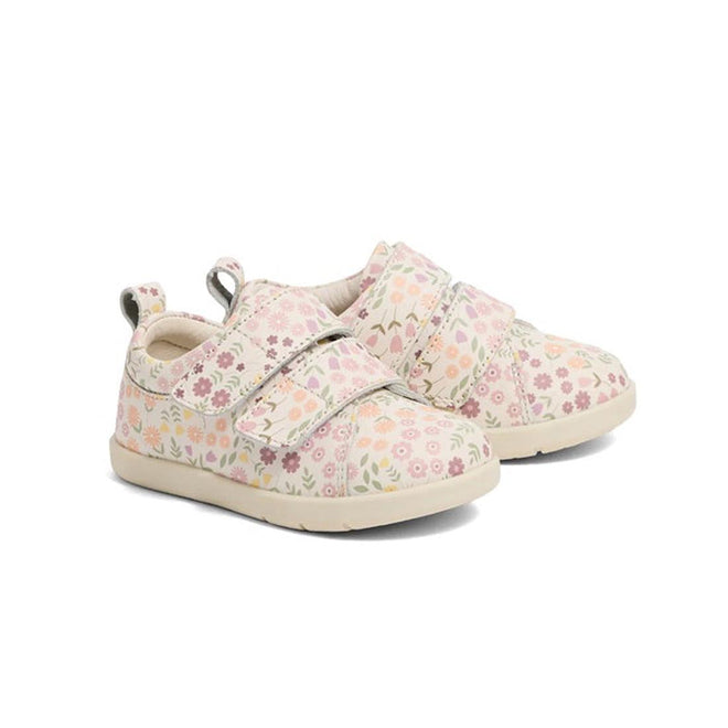 Pair of children's floral sneakers on a white background