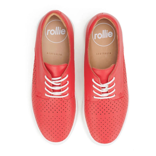 A pair of Rollie Womens Derby City Punch Red Leather Trainers with perforated red uppers, white soles and laces, tan insoles labeled "rollie AUSTRALIA," shown from above., 9781760775599, 9781760775605, 9781760775612, 9781760775629, 9781760775636