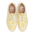 The Rollie Womens Derby Sunshine Splash Leather Shoe offers sneaker-like comfort and features a yellow banana pattern on white. Tan insoles, printed with "rollie" and "AUSTRALIA," are visible from the top view., 9781760774783, 9781760774790, 9781760774806, 9781760774813, 9781760774820