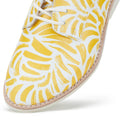 Close-up of the Rollie Womens Derby Sunshine Splash Leather Shoe in white premium leather with yellow abstract brushstrokes, white laces, and light stitching along the sole for sneaker-like comfort., 9781760774783, 9781760774790, 9781760774806, 9781760774813, 9781760774820