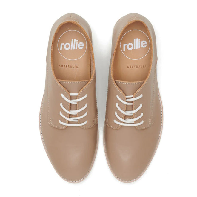 The Rollie Womens Derby Super Soft Latte Leather Shoe is a beige lace-up Derby made from premium leather with white laces and tan-lined insoles featuring “rollie AUSTRALIA,” delivering sneaker-like comfort., 9781760763848, 9781760763855, 9781760763862, 9781760763879, 9781760763886
