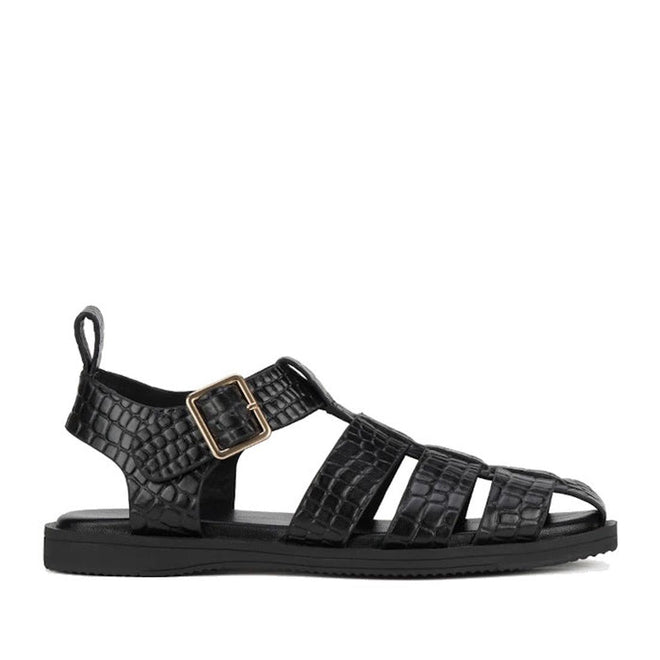 Rollie Womens Fisherman Sandal in black embossed leather featuring a gold buckle ankle strap, flat sole, and a cushy padded footbed., 9339554003016, 9339554003023, 9339554003030, 9339554003047, 9339554003054, 9339554003061