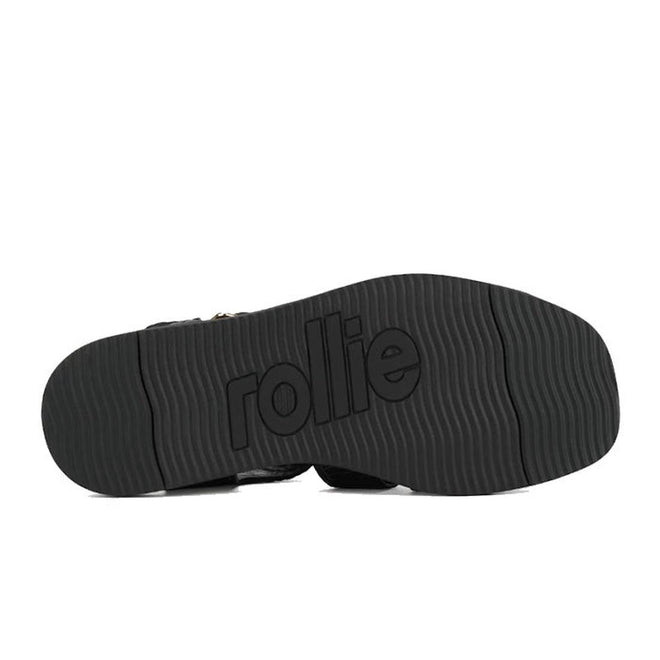 Black leather sole of a Rollie Womens Fisherman Sandal Black Embossed Leather featuring a wavy tread pattern and the brand name embossed in the center., 9339554003016, 9339554003023, 9339554003030, 9339554003047, 9339554003054, 9339554003061