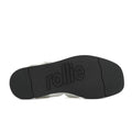 Black textured sole of the Rollie Womens Fisherman Sandal White Black Leather with a wavy pattern and a cushy padded footbed, featuring the brand name embossed in the center., 9339554003092, 9339554003108, 9339554003115, 9339554003122, 9339554003139, 54669
