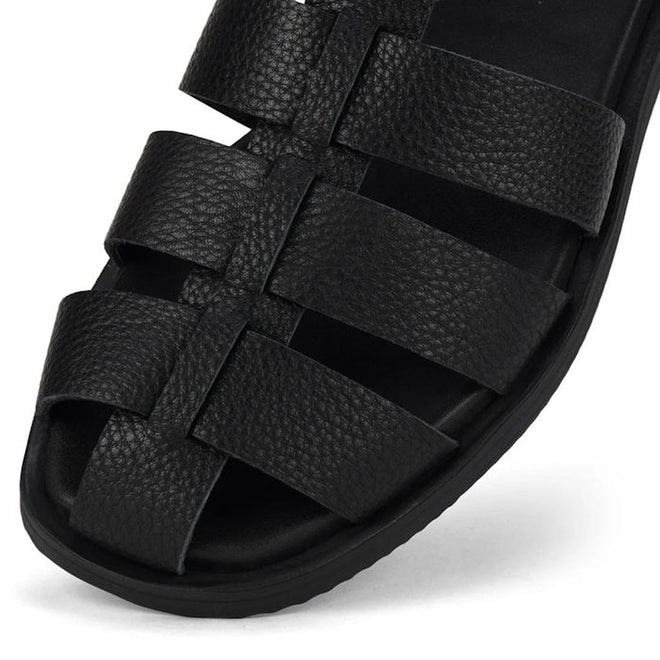 Toe close up of Rollie Fisherman Black sandal with multiple straps and textured pebbled look on the leather on a white background. Also showing slightly square toe.,
9781760777722,
9781760777739,
9781760777746,
9781760777753,
9781760777760,
9781760777777,