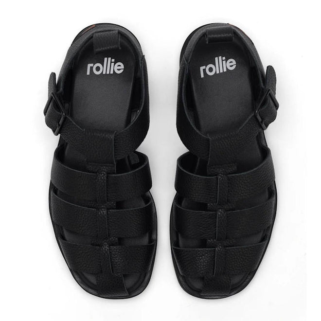 Top down view of a pair of Rollie Black fisherman sandals black  with 'rollie' branding on the footbed and ankle buckle on a white background. Letaher has a textured pebbled look.,
9781760777722,
9781760777739,
9781760777746,
9781760777753,
9781760777760,
9781760777777,