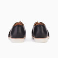 The Rollie Womens Sidecut Punch Black Leather Shoe features cushy EVA midsoles and white soles, shown from the back on a plain white background., 9339554249179, 9339554249186, 9339554249193, 9339554249209, 9339554249216, 9339554249223, 9339554249230