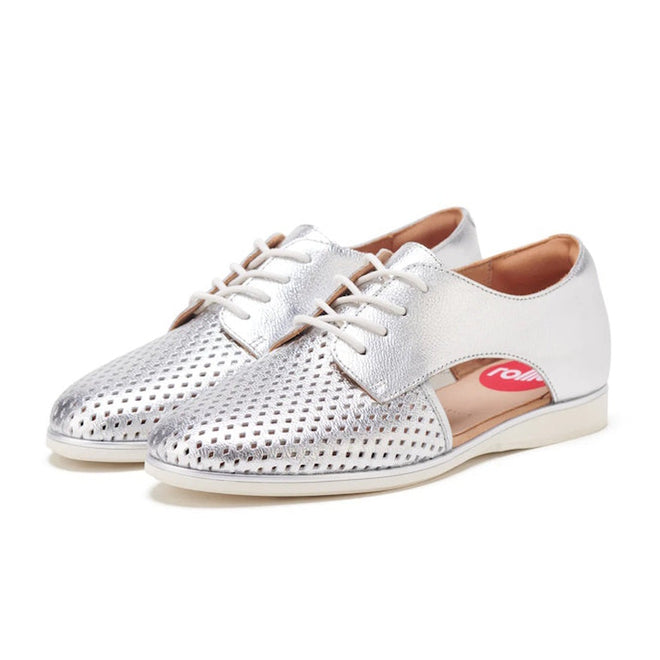 The Rollie Womens Sidecut Punch Silver Metallic Leather Shoe features stylish perforated detailing for breathability, white soles, and a side cutout showing a pink insole., 9339554231341, 9339554231358, 9339554231365, 9339554231372, 9339554231389