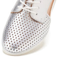 Close-up of the Rollie Womens Sidecut Punch Silver Metallic Leather Shoe, with a metallic silver perforated toe, white leather upper, white laces, beige lining, and an anti-slip rubber outsole for stability., 9339554231341, 9339554231358, 9339554231365, 9339554231372, 9339554231389