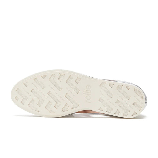 The image shows the white anti-slip rubber outsole of the Rollie Womens Sidecut Punch Silver Metallic Leather Shoe, featuring a herringbone tread pattern and 'rollie' embossed in the center., 9339554231341, 9339554231358, 9339554231365, 9339554231372, 9339554231389