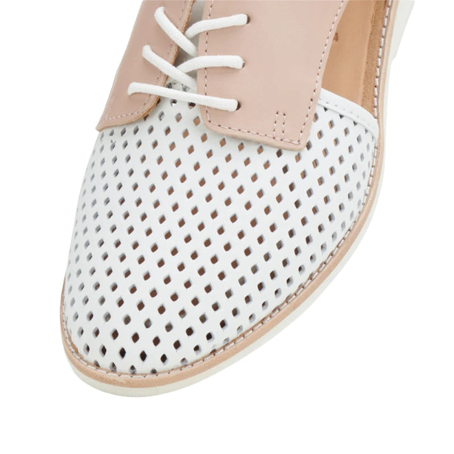 Close-up of a white perforated Rollie Womens Sidecut Punch White/Chalk Pink Leather Shoe with a pale pink lace-up panel and white laces, designed as breathable footwear., 9781760765675, 9781760765682, 9781760765699, 9781760765705, 9781760765712