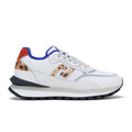 The Rollie Womens Kentu Retro Leopard Trainer is a white athletic sneaker with blue and red accents, leopard-print heel detail, perforated toe, white laces, a chunky black-and-white sole, and an anti-slip rubber outsole for excellent traction.