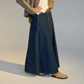 Person wearing a long denim skirt with  a pair or Rollie Mills Mule in Camel suede on feet on a neutral background.,
9781760789114,
9781760789121,
9781760789138,
9781760789145,
97817760789152,