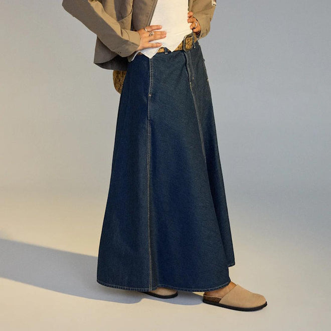 Person wearing a long denim skirt with  a pair or Rollie Mills Mule in Camel suede on feet on a neutral background.,
9781760789114,
9781760789121,
9781760789138,
9781760789145,
97817760789152,