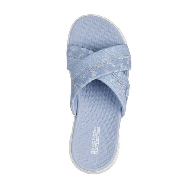 A single Skechers Go Walk Flex Women's Sandal Slide Butterfly Bliss in periwinkle, featuring textured crisscross straps and a cushioned Goga Mat footbed with visible branding near the heel, viewed from above., 47970, 47971, 199025957625, 199025957632, 199025957649, 199025957656, 47976