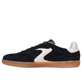 The Skechers Mens Hot Shot Azir Black Netural Lace Up Sneaker, shown from the left side, features black suede, a white wave logo and heel, translucent gum sole, signature Hotshot design, and Air-Cooled Memory Foam for comfort.