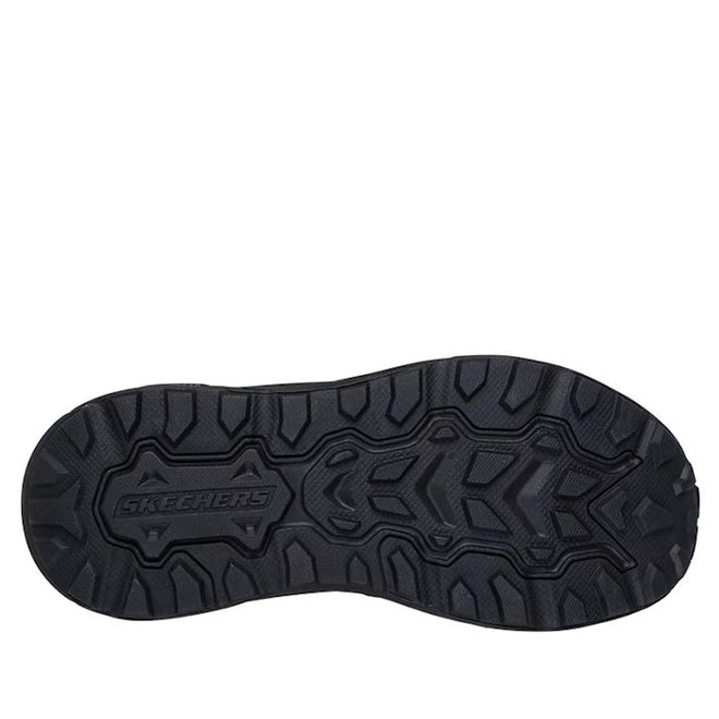 The image displays the black textured sole of Skechers Slip-ins Relaxed Fit: Conner - Rayne Mocc Sneaker, with deep rugged treads and the Skechers logo embossed in the center for reliable grip., 52119, 52120, 198739677461, 198739677485, 198739677508