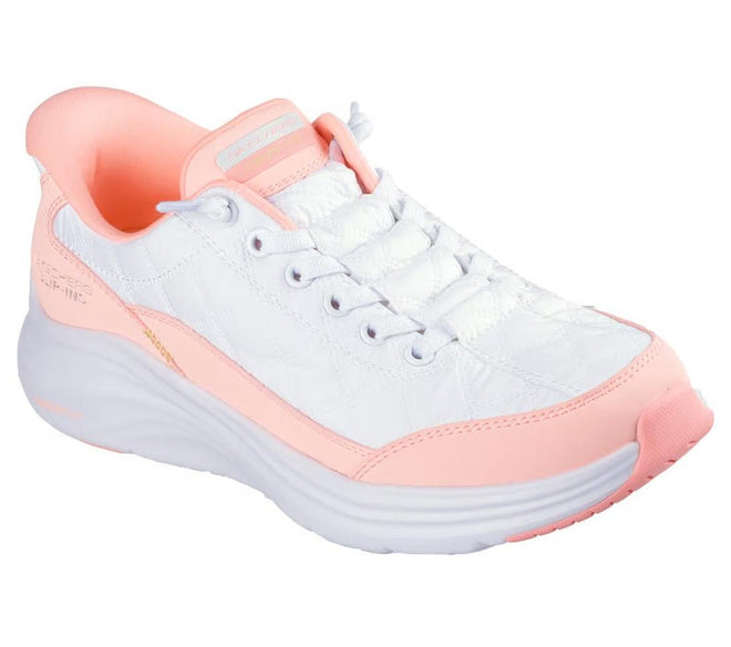 The Skechers Womens Slip In Contour Foam Cozy Fit White Hot Coral Sneakers feature a sporty white design with light pink accents, cushioned Contour Foam sole, pink lining and outsole edge, white laces, and a modern look.