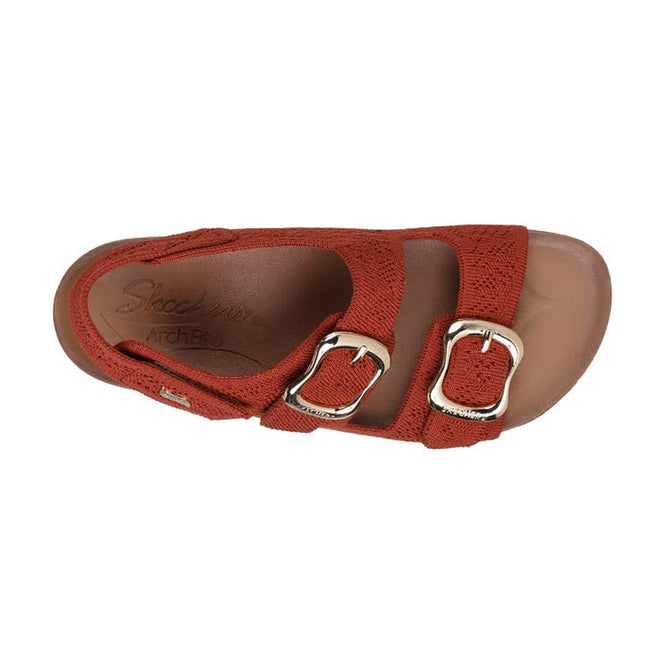 The Skechers Womens Arch Fit Granola Special Summer Cinnamon Rust Sandal features two silver buckles on red textured vegan straps, a brown contoured footbed, and podiatrist-certified arch support with the Skechers Arch Fit logo on the insole., 49100, 49101, 198739146905, 198739146912, 198739146929, 198739146936, 49106