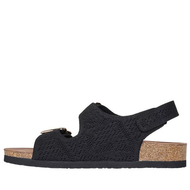 The Skechers Womens Arch Fit Granola Special Summer Black Sandal features a textured upper, buckle detail, adjustable heel strap, cork sole with flat black rubber base, and podiatrist-certified arch support. Shown in side profile on white., 49055, 198376896683, 198376896690, 198376896706, 198376896713, 198376896720, 198376896737