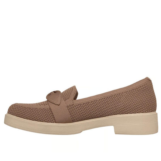 The Skechers Womens Cleo Taylor Desire Mocha Fabric Loafer features a light brown knit upper, decorative strap and bow, memory foam insole, beige rubber sole, and is displayed in side profile against a white background., 50631, 50632, 198376067236, 198376067250, 50635, 50636