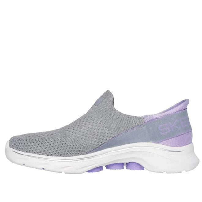 The Skechers Womens Slip-Ins GO WALK 7 Mia in Grey Lavender features a breathable mesh upper, Air-Cooled Memory Foam insole, white sole, light purple accents, and Skechers branding on the heel., 38371, 38372, 197627364025, 197627364032, 197627364049, 197627364056, 197627364063, 38378, 38379, 38380