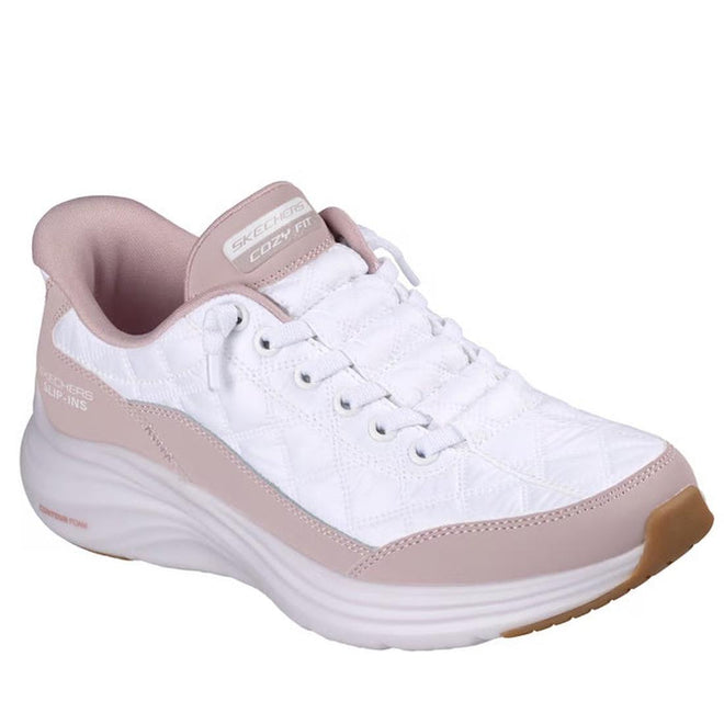The Skechers Womens Slip In Contour Foam Cozy Fit White Lavender Puffer Sneakers features a white upper with light lavender accents, quilted sides, slip-in design, and a thick cushioned sole with Air-Cooled Memory Foam for all-day comfort.