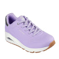 The Skechers Uno Shimmer Away Lilac Trainer Pull On features a lavender upper, white midsole, light brown gum outsole, silver heel accent, Air-Cooled Memory Foam cushioning, and perforated toe detailing.