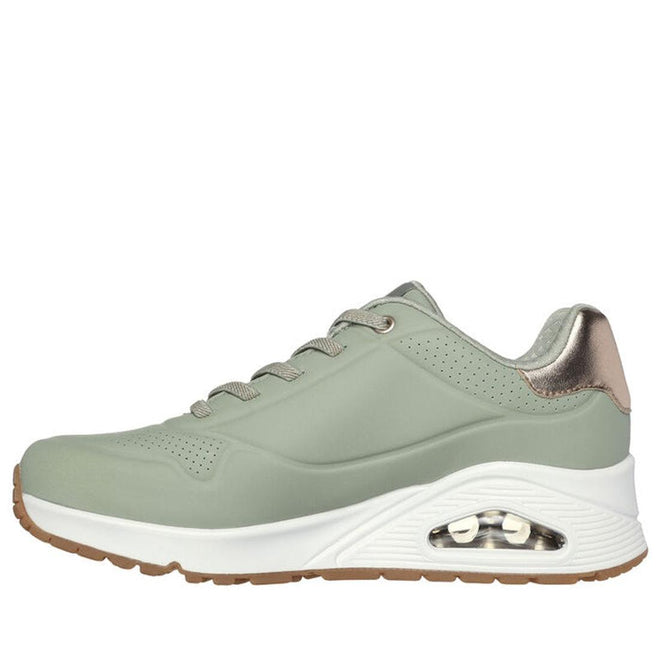 The Skechers Uno Shimmer Away Sage Trainer Pull On is a light green athletic sneaker with a thick white sole, visible heel air cushion, light brown outsole, metallic heel accent, breathable perforations, and Air-Cooled Memory Foam comfort., 38391, 38392, 197627201382, 38394, 197627201405, 38396, 197627201429, 38398, 38399, 38400