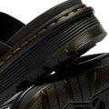 Close-up of Dr Martens Zebzag Black EH Suede Slide Sandal featuring detailed yellow stitching, textured rubber soles, a ribbed heel, and sturdy air-cushioned sole construction that highlights expert craftsmanship., 190665790689, 190665790696, 190665790702, 190665790726, 190665790733, 52118