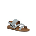 The Soultbush Flinders Denim Women’s Sandal with Back Strap is a light blue sandal featuring three straps and an open toe, complemented by a brown flat sole and a cushioned footbed for all-day comfort. An adjustable Velcro back strap ensures a secure fit. The sandal is displayed against a plain white background.