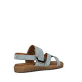 Soultbush Flinders Denim Women’s Sandal with Back Strap features a light blue synthetic upper, open toe, ankle strap with buckle, and a flat brown sole with a cushioned footbed. The sandal is shown from the back and side against a white background.