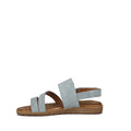 The Soultbush Flinders Denim Women’s Sandal with Back Strap features a light blue synthetic upper, two front straps, an ankle strap, and a flat brown sole with a cushioned footbed, shown in side profile on a white background.