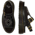 A pair of Dr Martens Dunnet Flower Sandal Black Quad Platform with a 90s-inspired design, platform sole, white stitching, double metal buckles, and floral cutout toe; one sandal shown from the top, the other from the side., 190665809190, 190665809206, 190665809213, 190665809237, 190665809244, 52092