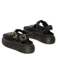 The Dr Martens Dunnet Flower Sandal Black Quad Platform features a thick platform sole, two gold buckles, white stitching, and white embroidered designs on the top straps for a bold 90s-inspired look., 190665809190, 190665809206, 190665809213, 190665809237, 190665809244, 52092
