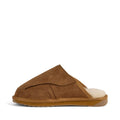 The EMU FlexiCare Wide Opening Sheepskin Scuff Chestnut Slipper features a brown suede exterior, closed toe, open heel, tan rubber sole, and plush off-white lining for warmth and comfort. Shown in side profile on a white background., 9330071991091, 9330071991107, 9330071991114, 9330071991121, 9330071991138, 9330071991145, 52528, 52529, 52530