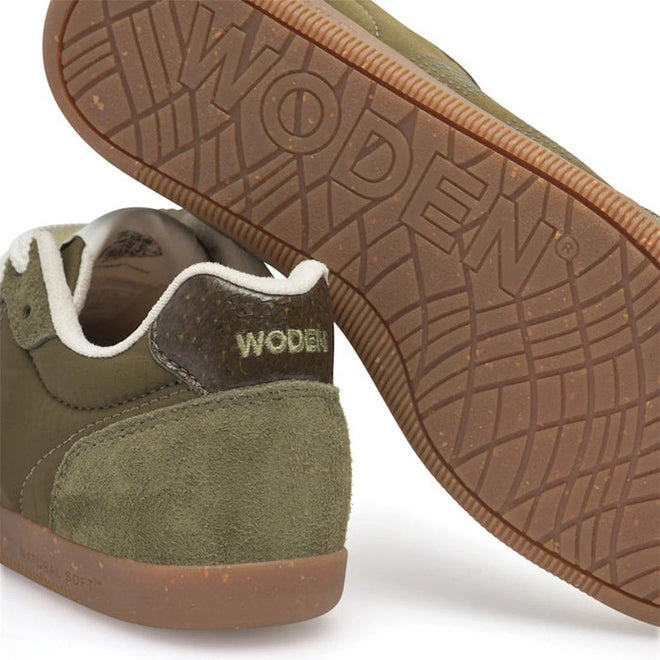 Close-up of the Woden Nanna Dark Olive Lace Up Sneaker with brown soles, suede and leather textures, and a white inner lining. Featuring Natural Soft Technology, this lightweight shoe provides travel-friendly comfort., 5713326697506, 5713326697513, 5713326697520, 5713326697537, 5713326697544, 5713326697551