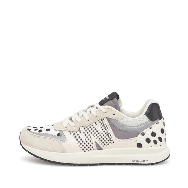The Woden Rigmor Animal Damlation Lace Up Sneaker features white laces, beige and light gray panels, black polka dot accents, a black and white sole, a textured N logo, and high-quality LWG certified leather.
