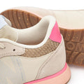 Close-up of the Woden Ronja Ivory Blush Lace Up Sneaker featuring beige leather, a textured brown heel, pink back accent, light blue side panel, cork insole, and a gum sole with tread pattern and partial "WORKS" embossing., 50265, 5713326700633, 5713326700640, 5713326700657, 5713326700664, 5713326700671