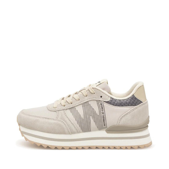 The Woden Ronja Plateau Delpin Lace Up Sneaker features a beige and cream suede finish, textured sole, perforated sides, and subtle fish leather accents, shown in a side view on a white background.