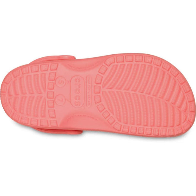The image shows the sole of the Crocs - Classic Clog Adults Guava Pink Orange, highlighting its textured tread pattern and size markings that represent signature Crocs comfort., 49797, 49798, 49799, 49800, 49801, 49802, 49803, 49804, 49805